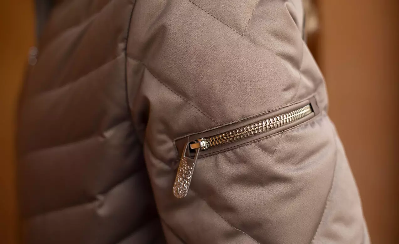 This jacket contains THERMOLITE® EcoMade T-DOWN insulation, a synthetic down replacement made form 100% recycled PET bottles.