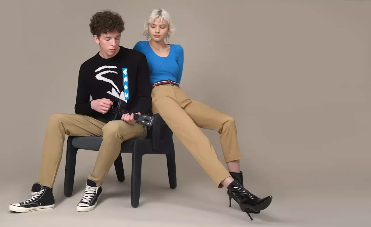 A young couple models woven pants powered by the 360o comfort and fit of LYCRA® XFIT technology.