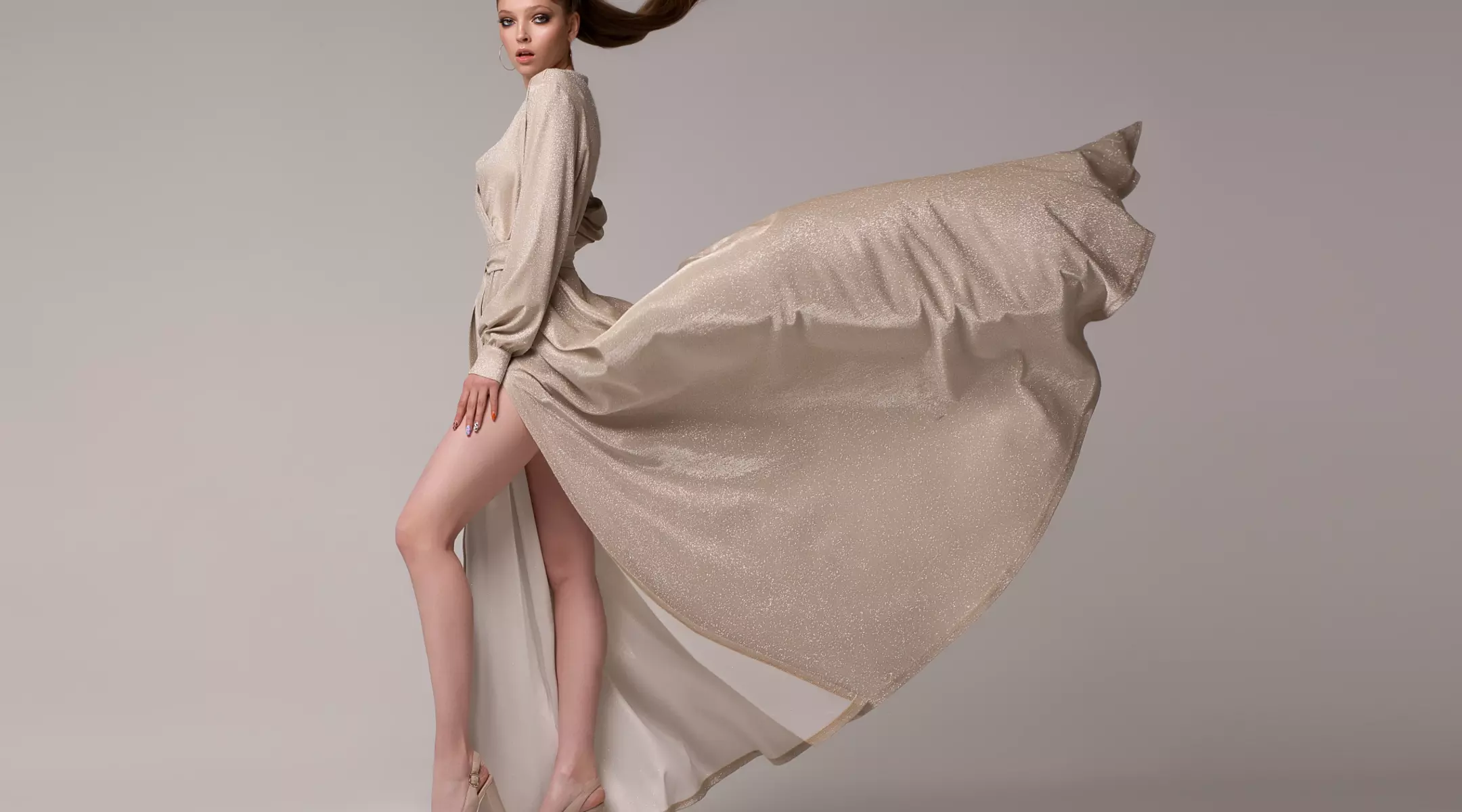 Model in designer dress. LYCRA® fiber was named a top apparel innovation of the 20th century by American fashion designers.